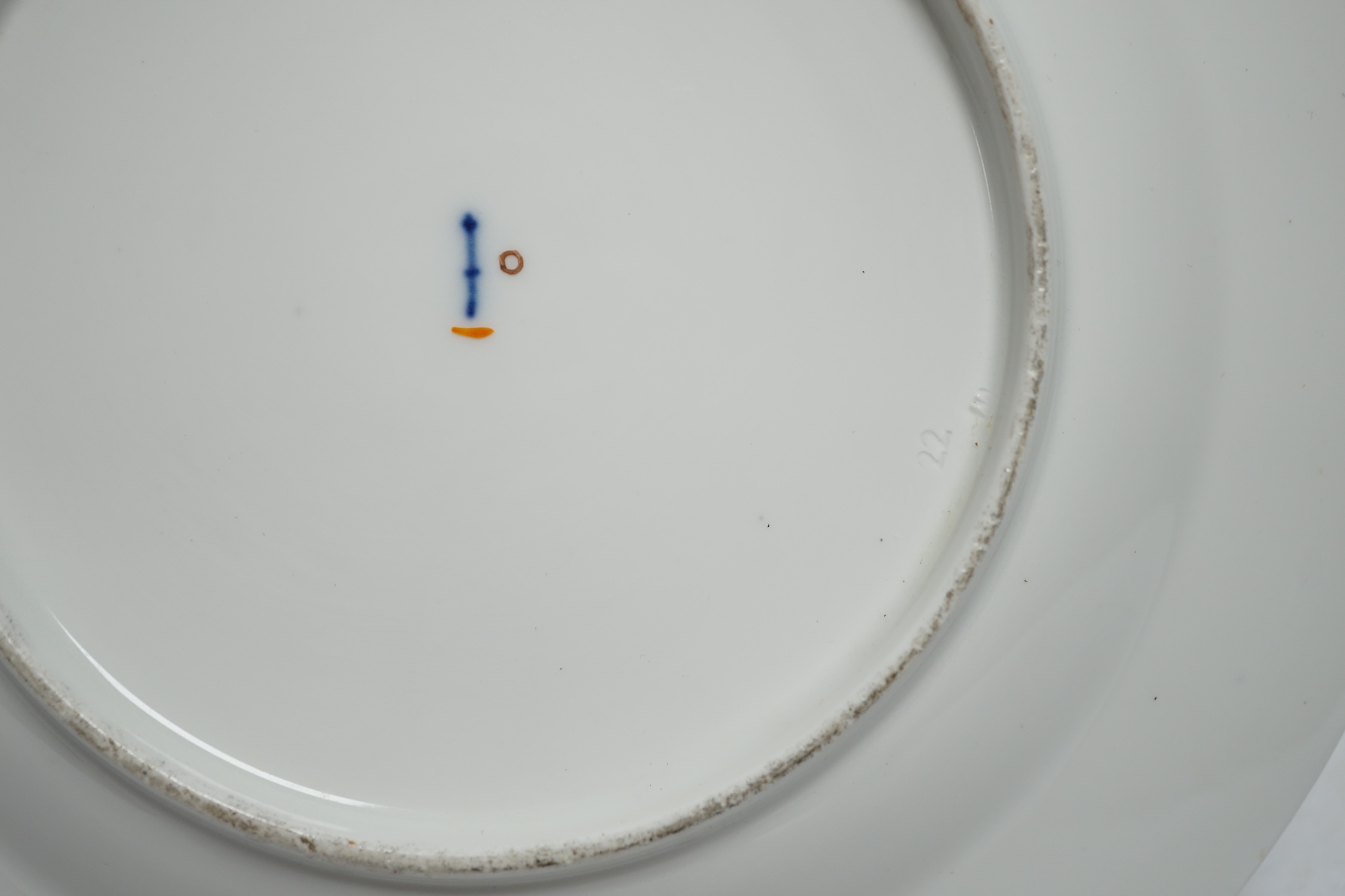 A Berlin porcelain dish painted with a groom with horses, first half of 19th century, 25cm diameter